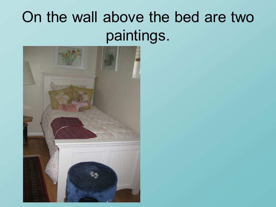On the wall above the bed are two paintings.
