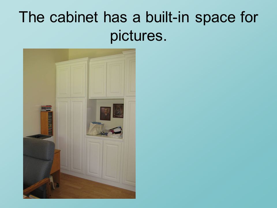 The cabinet has a built-in space for pictures.