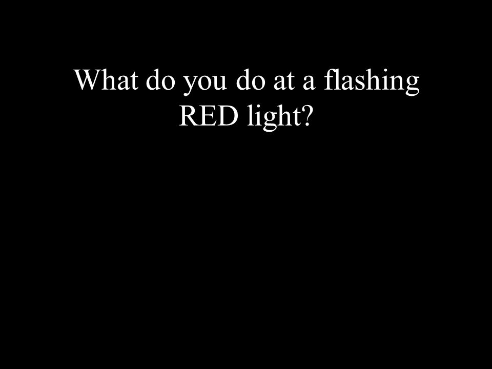 What do you do at a flashing RED light