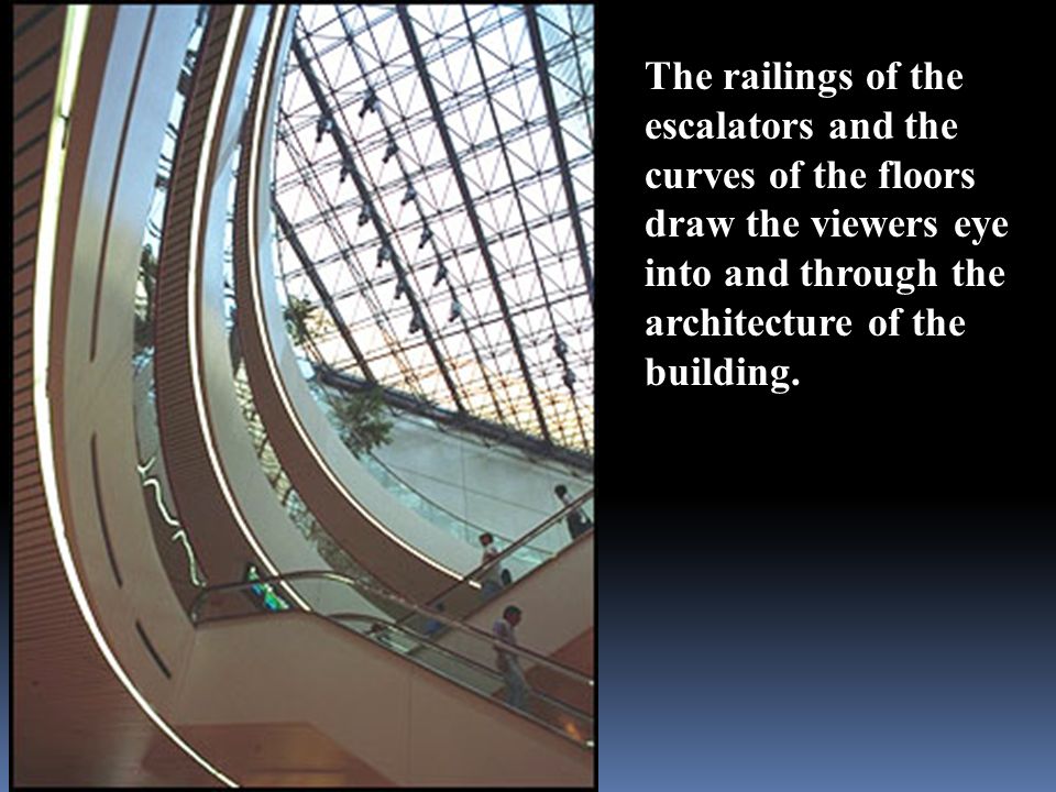 The railings of the escalators and the curves of the floors draw the viewers eye into and through the architecture of the building.