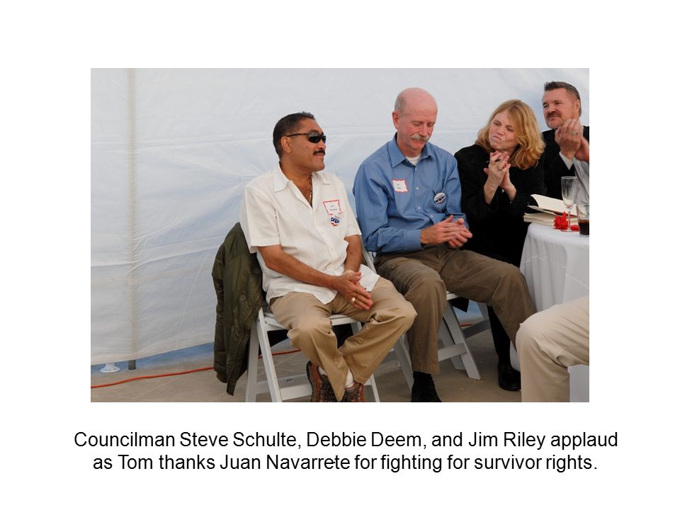 . Councilman Steve Schulte, Debbie Deem, and Jim Riley applaud as Tom thanks Juan Navarrete for fighting for survivor rights.