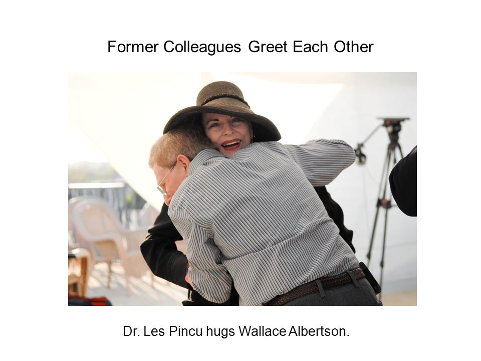Dr. Les Pincu hugs Wallace Albertson. Former Colleagues Greet Each Other