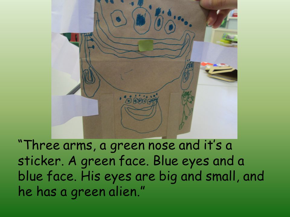 Three arms, a green nose and it’s a sticker. A green face.