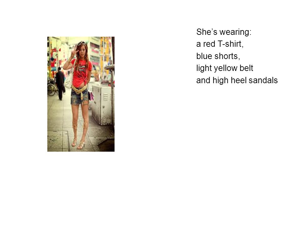 She’s wearing: a red T-shirt, blue shorts, light yellow belt and high heel sandals