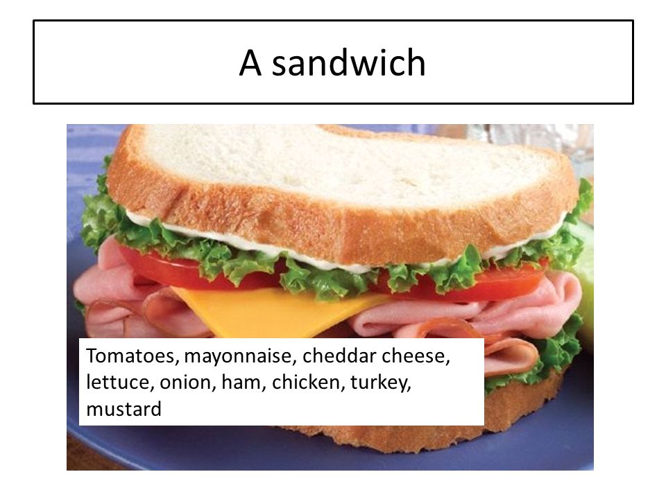 A sandwich Tomatoes, mayonnaise, cheddar cheese, lettuce, onion, ham, chicken, turkey, mustard