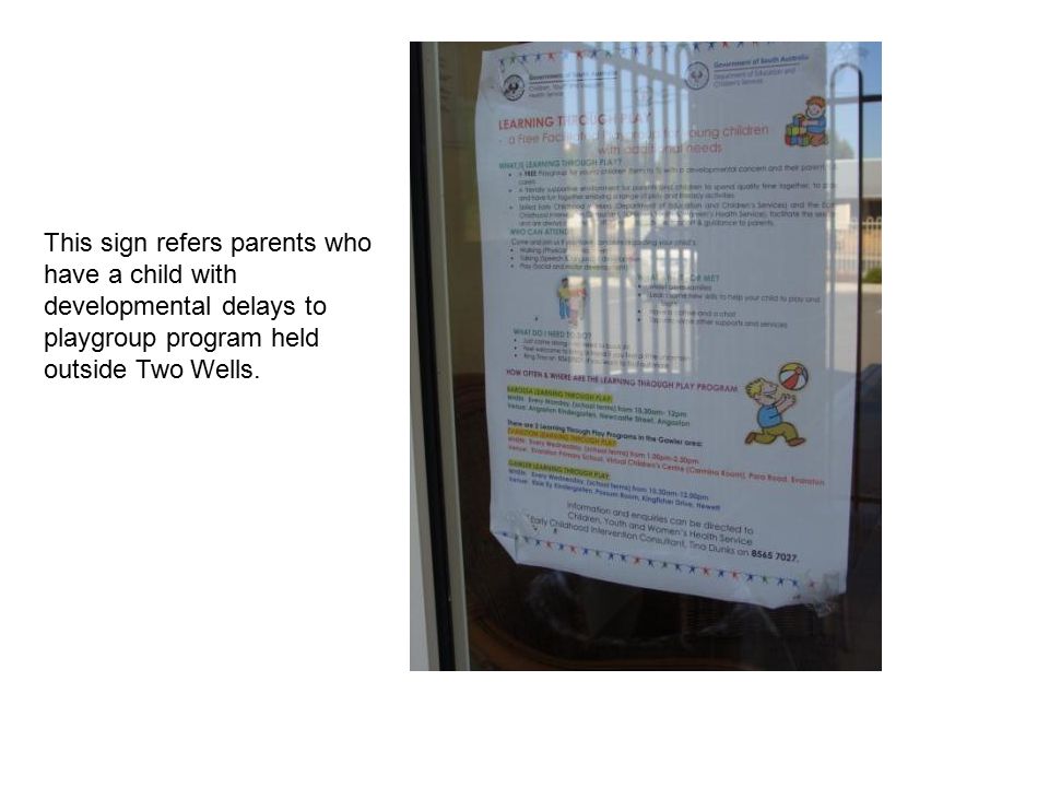 This sign refers parents who have a child with developmental delays to playgroup program held outside Two Wells.