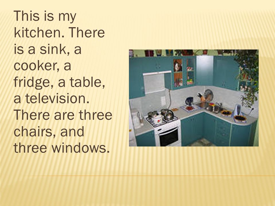 This is my kitchen. There is a sink, a cooker, a fridge, a table, a television.