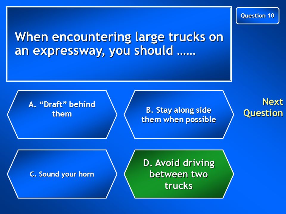 When encountering large trucks on an expressway, you should …… C.