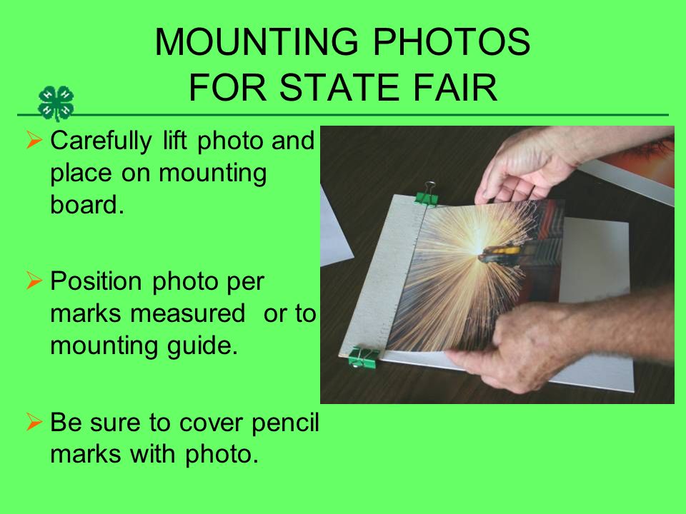 MOUNTING PHOTOS FOR STATE FAIR  Carefully lift photo and place on mounting board.