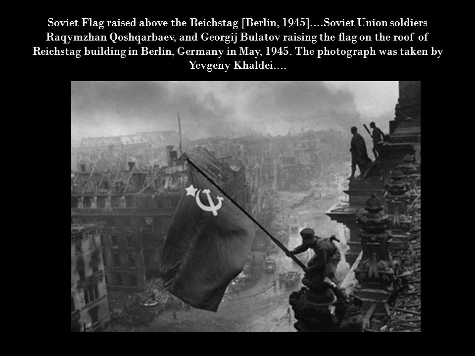 Soviet Flag raised above the Reichstag [Berlin, 1945]....Soviet Union soldiers Raqymzhan Qoshqarbaev, and Georgij Bulatov raising the flag on the roof of Reichstag building in Berlin, Germany in May, 1945.