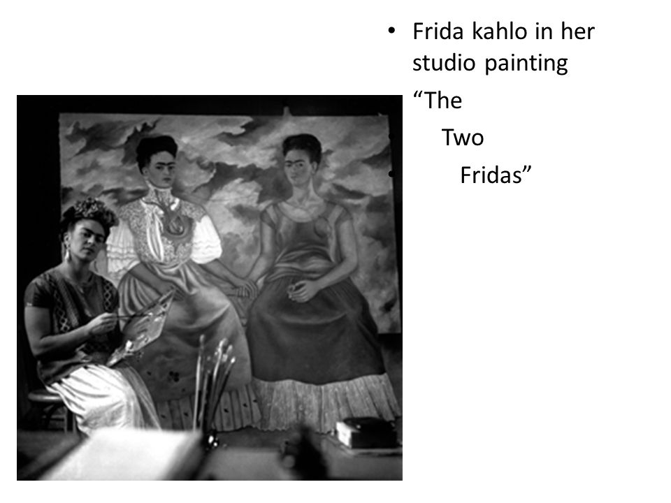 Frida kahlo in her studio painting The Two Fridas
