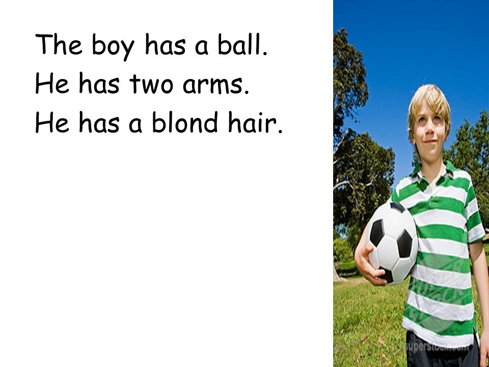 The boy has a ball. He has two arms. He has a blond hair.