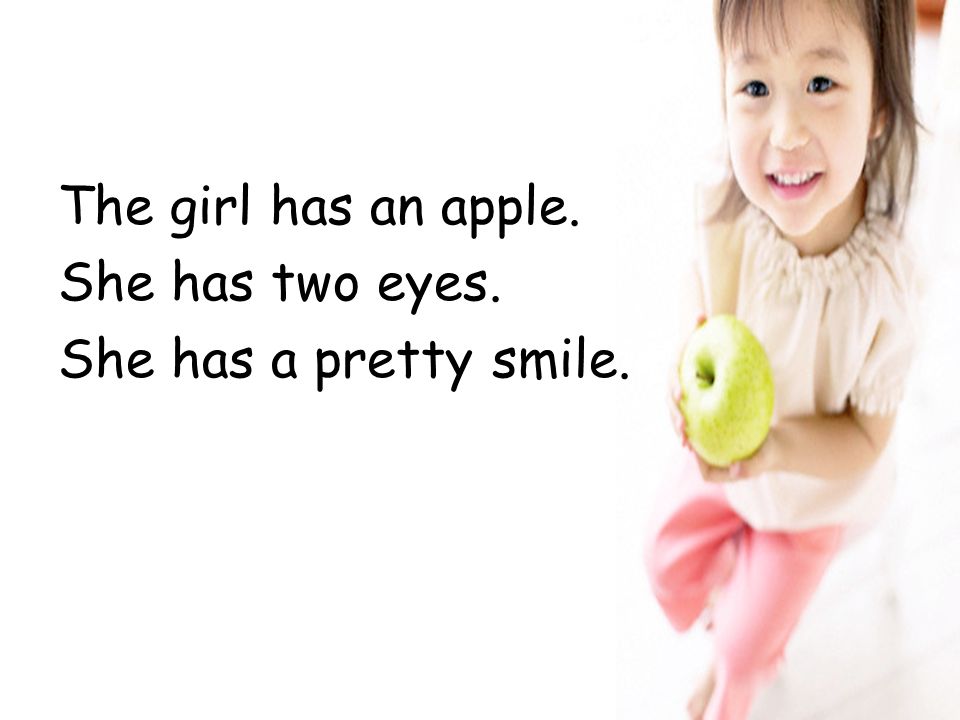 The girl has an apple. She has two eyes. She has a pretty smile.