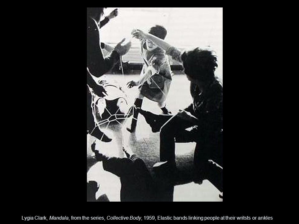 Lygia Clark, Mandala, from the series, Collective Body, 1959, Elastic bands linking people at their writsts or ankles