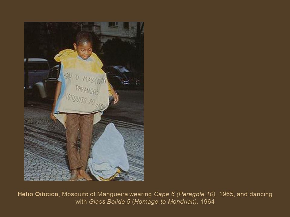 Helio Oiticica, Mosquito of Mangueira wearing Cape 6 (Paragole 10), 1965, and dancing with Glass Bolide 5 (Homage to Mondrian), 1964