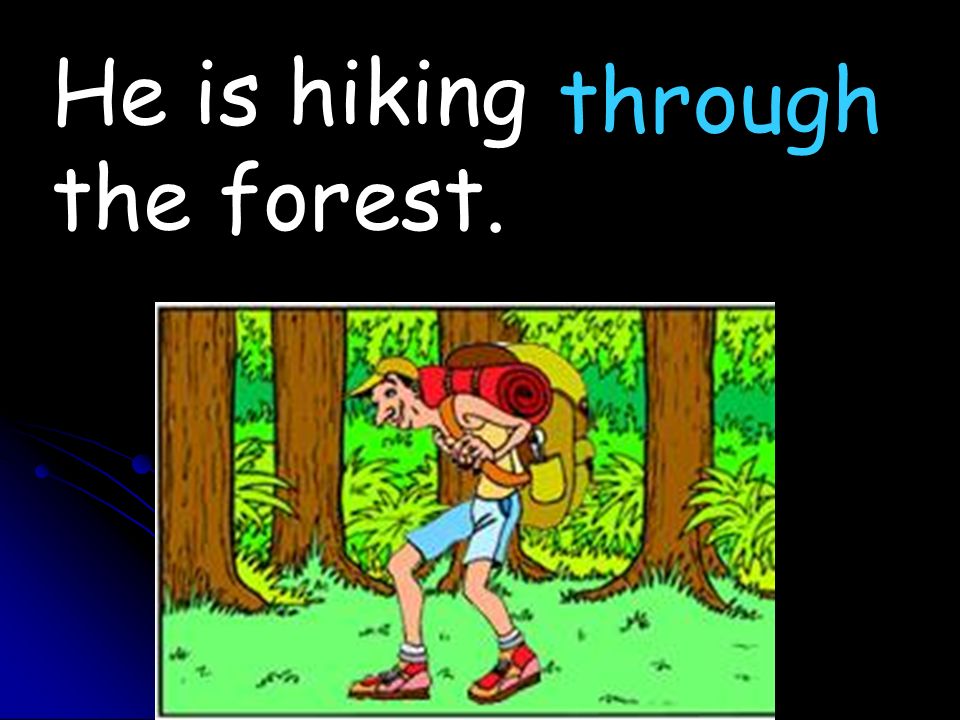 He is hiking the forest. through