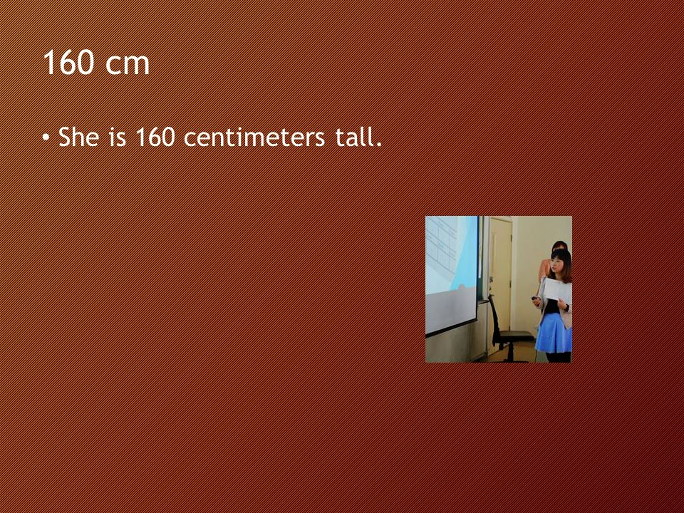 160 cm She is 160 centimeters tall.