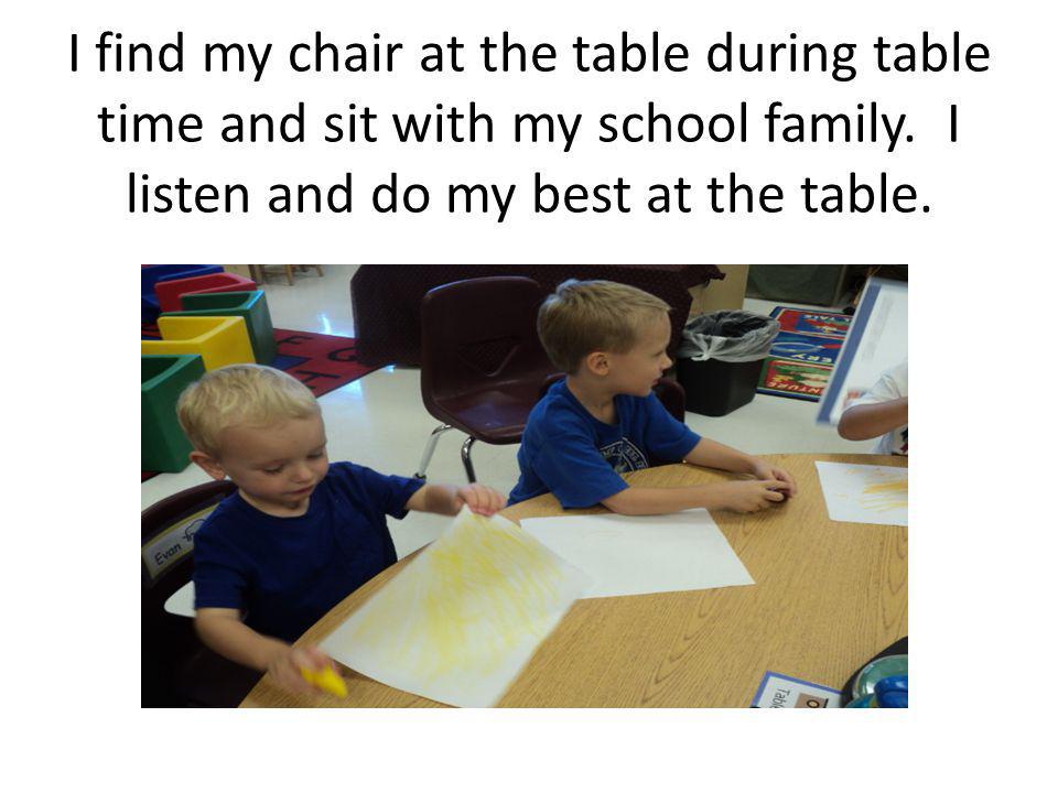 I find my chair at the table during table time and sit with my school family.