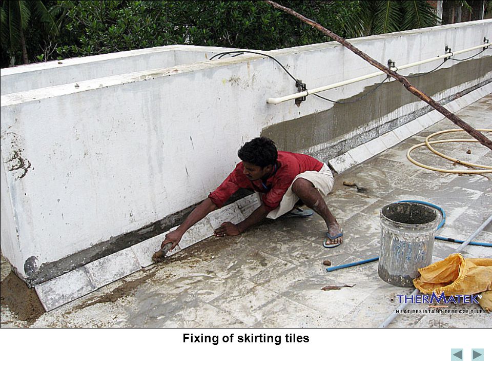 Fixing of skirting tiles