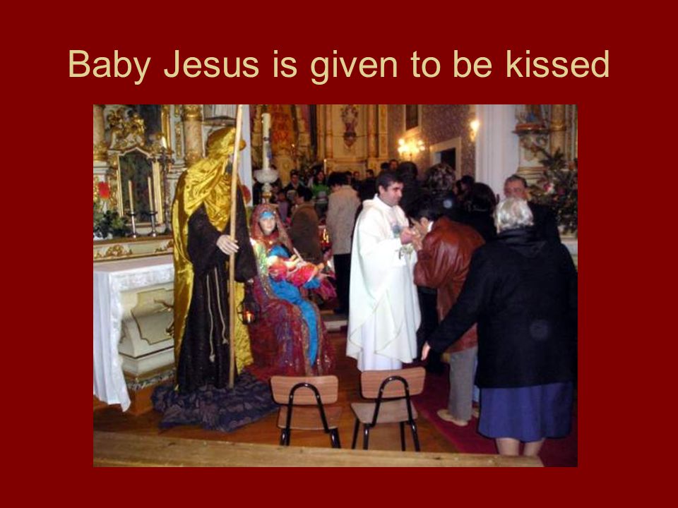 Baby Jesus is given to be kissed