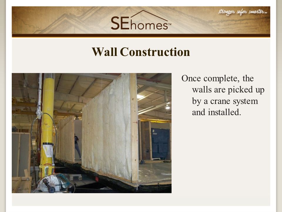 Once complete, the walls are picked up by a crane system and installed. Wall Construction