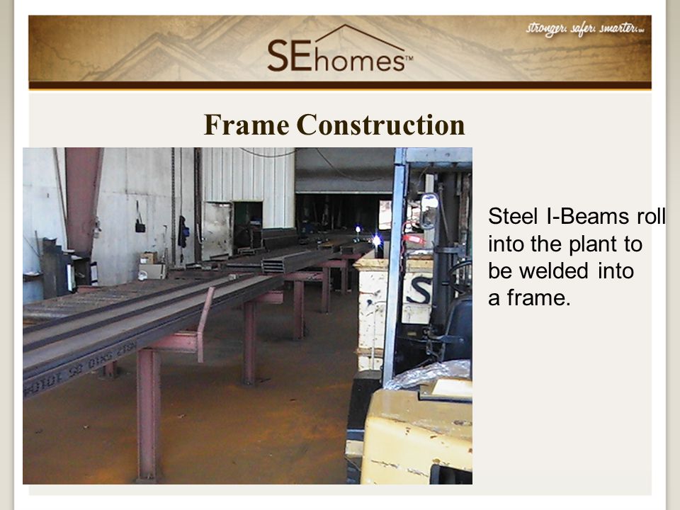 Frame Construction Steel I-Beams roll into the plant to be welded into a frame.