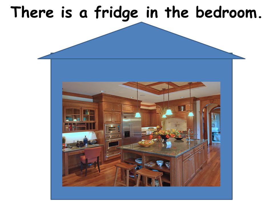 There is a fridge in the bedroom.
